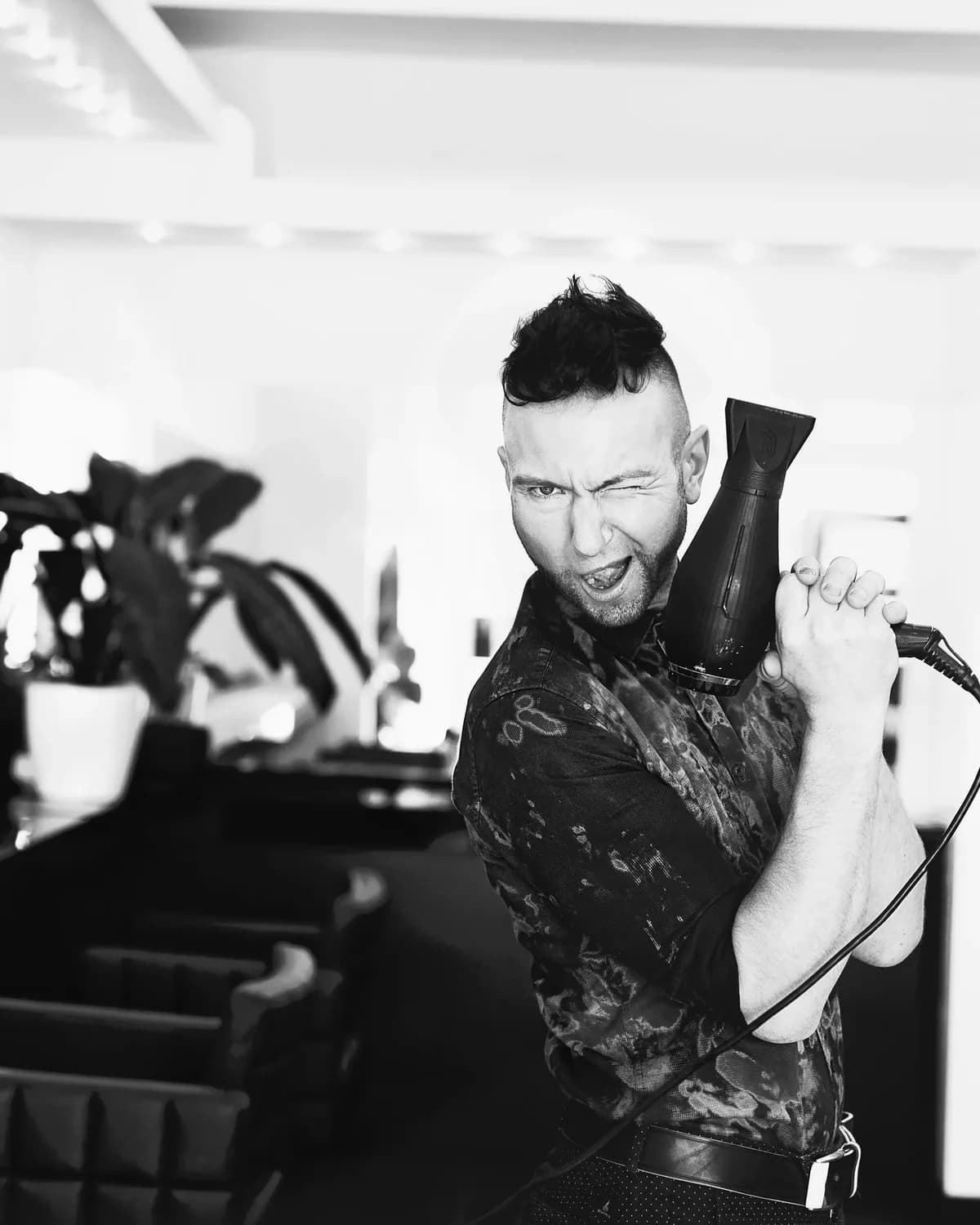 Ryan Waugh at work with a blow-dryer in the salon